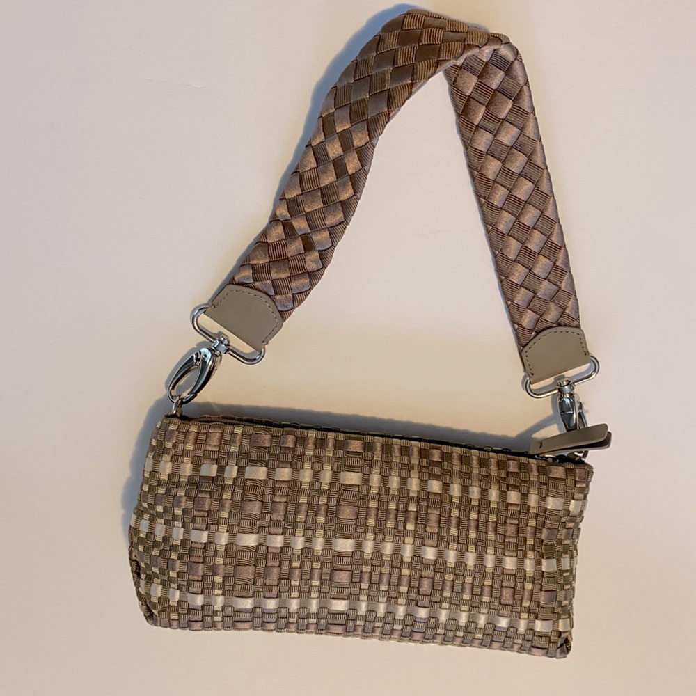 The SAK brown and cream colored crocheted bag